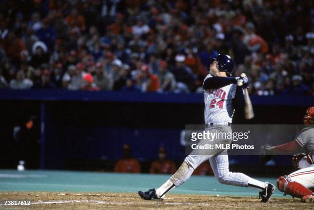 Outfielder Tom Brunansky of the Minnesota Twins watches the flight of his hit during the 1987 World Series game against the St. Louis Cardinals on...