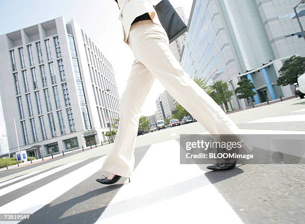 japanese business woman walking on urban - japanese women feet stock pictures, royalty-free photos & images