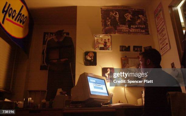 New York University student downloads music from the Napster site March 6, 2001 in New York City. Data released March 25, 2002 by the Recording...