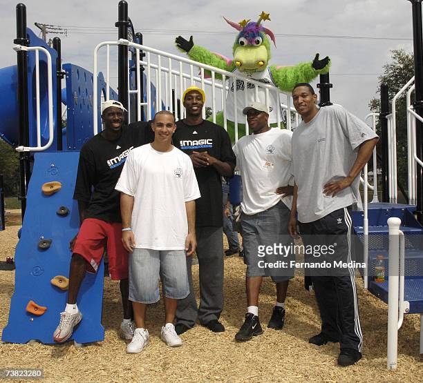 Orlando Magic players Bo Outlaw, Carlos Arroyo, Dwight Howard, former player and community ambassador Nick Anderson, Tony Battie and team mascot...
