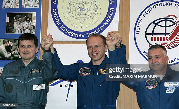 Former Microsoft software developer Charles Simonyi , Russian cosmonauts Oleg Kotov and Fyodor Yurchikhin pose after a press conference at Baikonur...