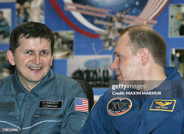 Former Microsoft software developer Charles Simonyi and Russian cosmonaut Oleg Kotov smile during a press conference at Baikonur Cosmodrome in...