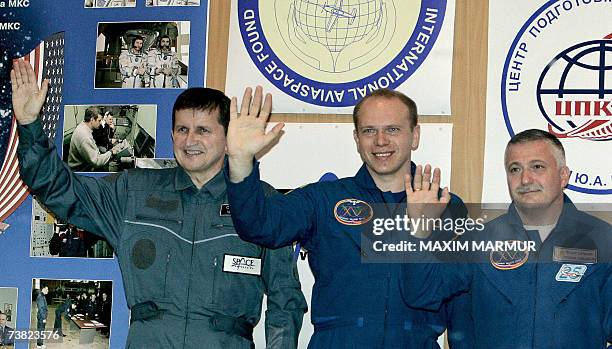 Former Microsoft software developer Charles Simonyi , Russian cosmonauts Oleg Kotov and Fyodor Yurchikhin pose after a press conference at Baikonur...