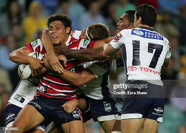 Anthony Tupou of the Sydney Roosters is group tackled by the the Brisbane Broncos during the round four NRL match between the Sydney Roosters and the...