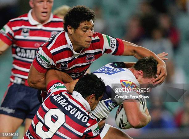 Shaun Berrigan of the Brisbane Broncos is tackled by the Sydney Roosters during the round four NRL match between the Sydney Roosters and the Brisbane...