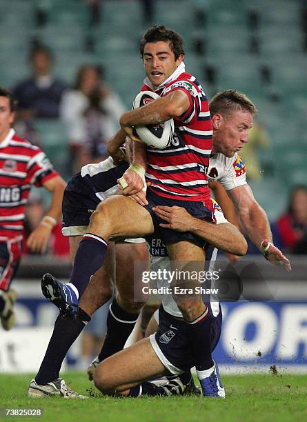 Anthony Minichiello of the Sydney Roosters is group tackled by the the Brisbane Broncos during the round four NRL match between the Sydney Roosters...