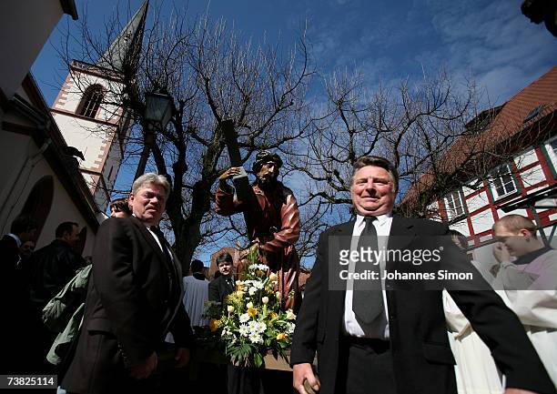 Members of the town's crafts guilds carry a likeness of Jesus Christ carrying his cross during a Good Friday procession on April 6 in Lohr am Main,...