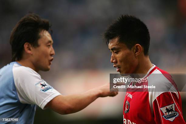 Zheng Zhi of Charlton Athletic looks on as Jihai Sun of Manchester City gestures during the Barclays Premiership match between Manchester City and...