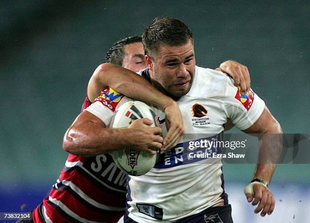 Ian Lacey of the Brisbane Broncos is tackled by the Sydney Roosters during the round four NRL match between the Sydney Roosters and the Brisbane...