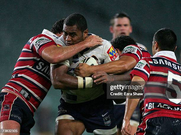 Petero Civoniceva of the Brisbane Broncos is tackled by the Sydney Roosters during the round four NRL match between the Sydney Roosters and the...