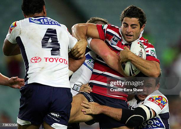 Anthony Minichiello of the Sydney Roosters is group tackled by the the Brisbane Broncos during the round four NRL match between the Sydney Roosters...