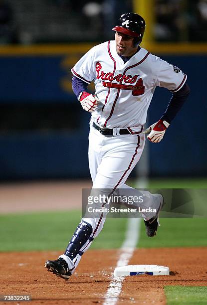 Jeff Francouer the Atlanta Braves rounds third base after hitting a solo homerun against the New York Mets in the bottom of the 4th inning during the...