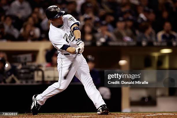 Second baseman Marcus Giles of the San Diego Padres singles to left in the third inning against the Colorado Rockies during Opening Night at Petco...