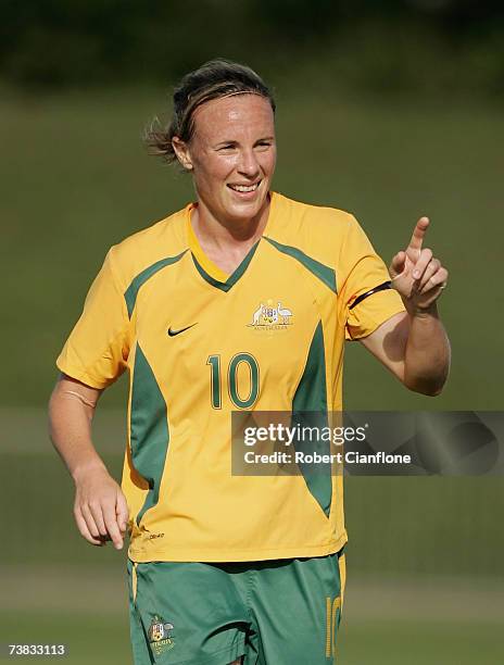 Joanne Peters of Australia celebrates a goal past Lun Kit Fong of Hong Kong during the Olympic Qualification match between Australia and Hong Kong at...