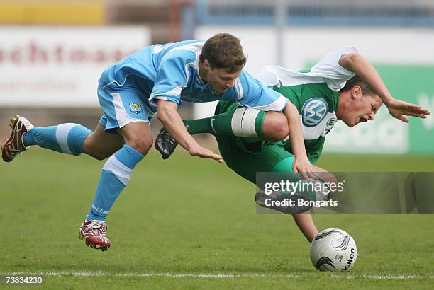 Kerst Lehmann of Chemnitzer FC vies with Jan Christian Meier of Wolfsburg during the semi final Match between Chemnitzer FC and VfL Wolfsburg on...