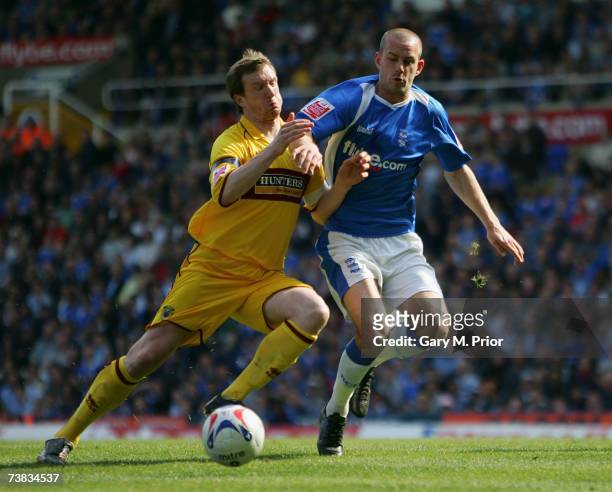 Rowan Vine of Birmingham City and Steven Caldwell of Burnley in action during the Coca Cola Championship match between Birmingham City and Burnley at...
