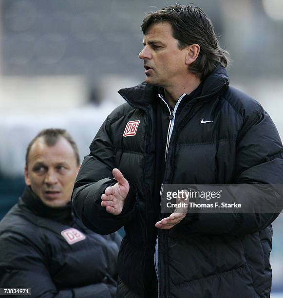 Head coach Falko Goetz and assistant coach Andreas Thom of Berlin look on during the Bundesliga match between Hertha BSC Berlin and Arminia Bielefeld...