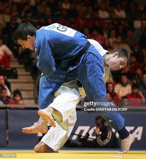 Britain's Euan Burton vies with Slovenia's Klemen Ferjan in the men's 81 kg for third place match of the Euro Judo Championship in Belgrade, 07 April...