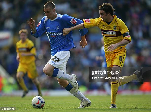 Nicklas Bendtner of Birmingham City and Mike Duff of Burnley in action during the Coca Cola Championship match between Birmingham City and Burnley at...