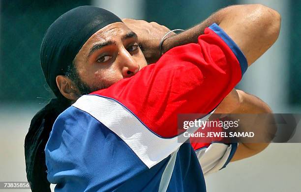 St John's, ANTIGUA AND BARBUDA: England's cricketer Monty Panesar delivers a ball during a practice session at the Sir Vivian Richards Stadium in St...