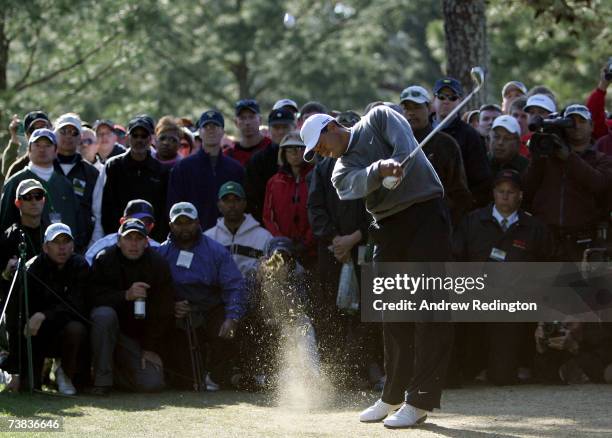 Tiger Woods hits his second shot on the 17th hole during the third round of The Masters at the Augusta National Golf Club on April 7, 2007 in...