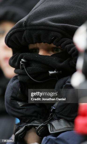 Year old Marshall Preusser of Geneva, Illinois trys to stay warm while watching the Chicago White Sox take on the Minnesota Twins on April 7, 2007 at...