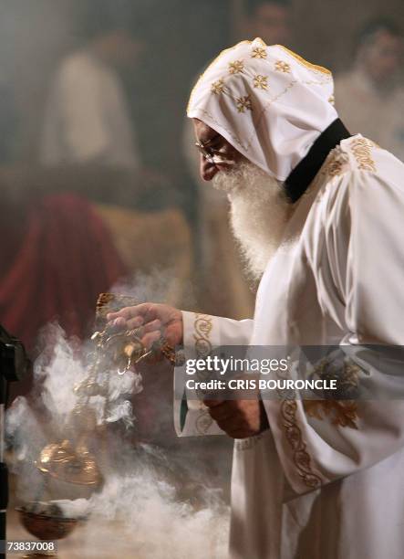 An Egyptian Copt monk burns incense prior to the Coptic Easter celebration mass directed by His Holiness Pope Shenouda III, the 117th Pope of The...