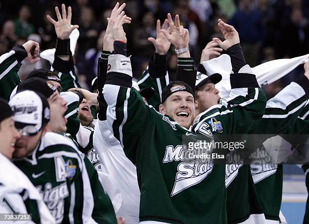 Chris Lawrence of the Michigan State Spartans and the rest of his teammates cheer after they defeated the Boston College Eagles during the Frozen...