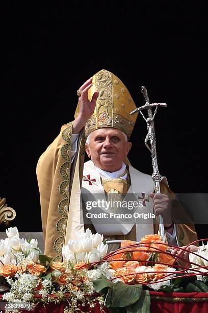 Pope Benedict XVI gives his 'Urbi et Orbi' message and blessing from the Central Loggia of the St. Peter's Basilica at the end of Easter Sunday Mass,...