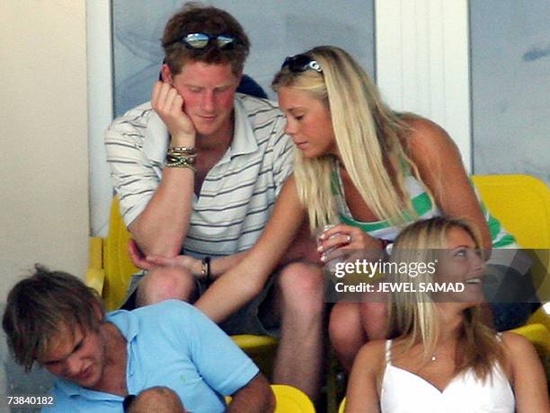 St John's, ANTIGUA AND BARBUDA: Britain's Prince Harry and his girlfriend Chelsy Davy share a private moment as they watch the ICC World Cup Cricket...