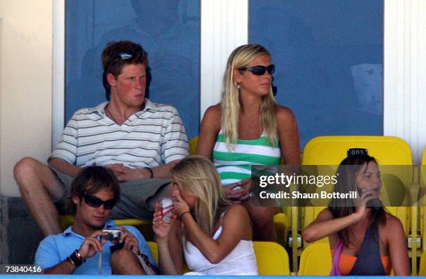 Prince Harry watches the cricket with his girlfriend Chelsy Davy during the ICC Cricket World Cup 2007 Super Eight match between England and...