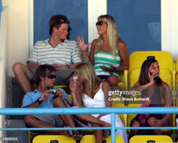 Prince Harry watches the cricket with his girlfriend Chelsy Davy during the ICC Cricket World Cup 2007 Super Eight match between England and...