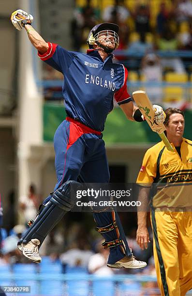 St John's, ANTIGUA AND BARBUDA: England's Kevin Pietersen jumps high off the ground after reaching his century during the Cricket World Cup Super...