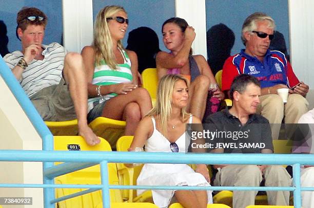 St John's, ANTIGUA AND BARBUDA: Britain's Prince Harry sits next to his girlfriend Chelsy Davy as he watches the ICC World Cup Cricket 2007 Super...