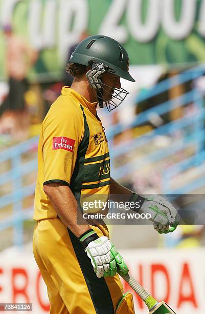 St John's, ANTIGUA AND BARBUDA: Australia's Adam Gilchrist leaves the field after being dismissed during the Cricket World Cup Super Eight match...