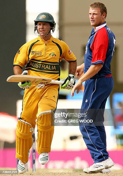 St John's, ANTIGUA AND BARBUDA: England's Andrew Flintoff watches as Australian batsman and captain Ricky Ponting takes a run during their Cricket...