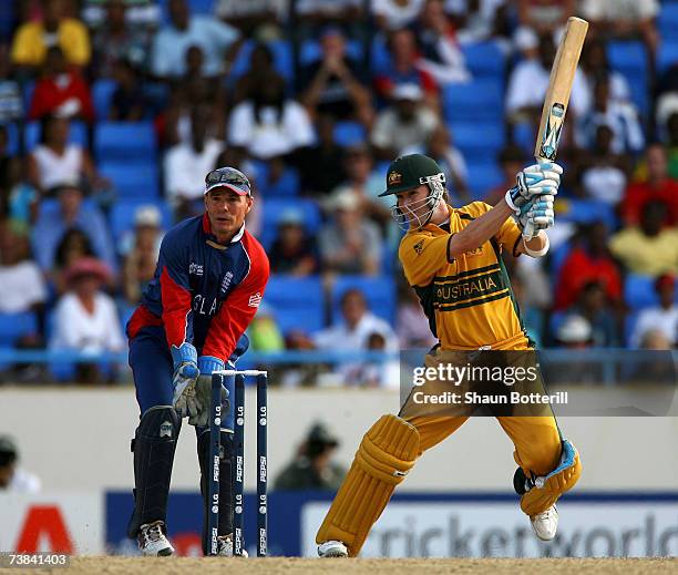 Michael Clarke of Australia plays a shot as Paul Nixon, the England wicket-keeper, looks on during the ICC Cricket World Cup 2007 Super Eight match...