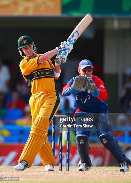 Michael Clarke of Australia in action watched by Paul Nixon of England during the ICC Cricket World Cup Super Eights match between Australia and...