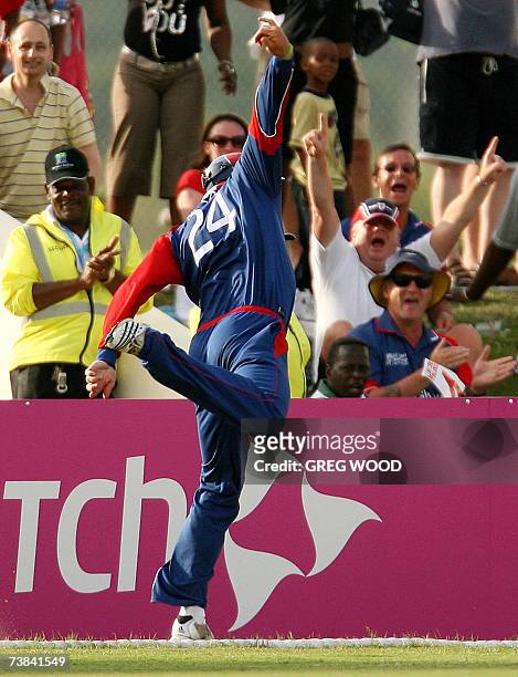 St John's, ANTIGUA AND BARBUDA: England's Kevin Pietersen makes a spectacular attempt to stay within the field of play after taking an outfield catch...