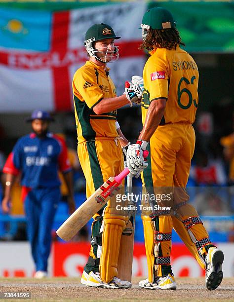Michael Clarke of Australia celebrates victory with team mate Andrew Symonds during the ICC Cricket World Cup Super Eights match between Australia...