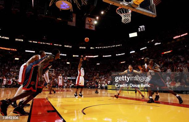 Dwyane Wade of the Miami Heat makes a game-tying free-throw with less than 2.5 seconds to play in the fourth quarter against the Charlotte Bobcats at...