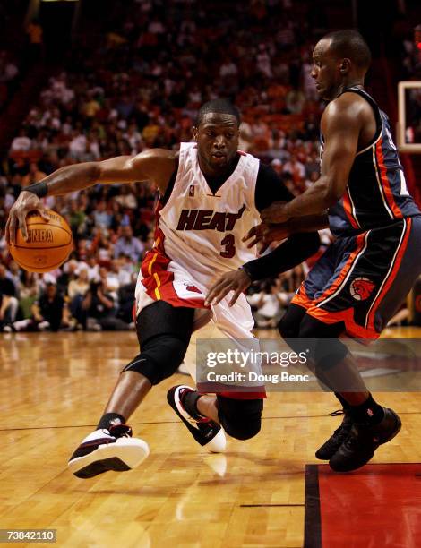 Dwyane Wade of the Miami Heat tries to drive past Raymond Felton of the Charlotte Bobcats at American Airlines Arena April 8, 2007 in Miami, Florida....