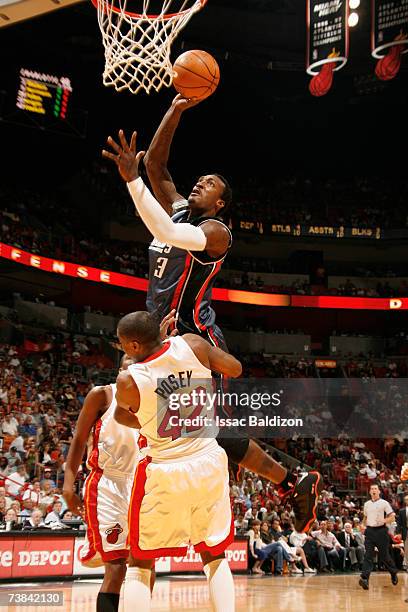 Gerald Wallace of the Charlotte Bobcats shoots against James Posey of the Miami Heat on April 8, 2007 at American Airlines Arena in Miami, Florida....