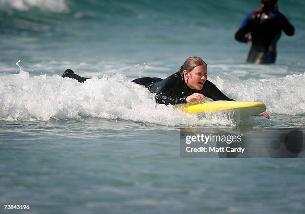 Girl bodyboards in the sea as she enjoys the holiday sunshine in Sennen on April 9, 2007 in Cornwall, England. The UK's Easter weekend was blessed...