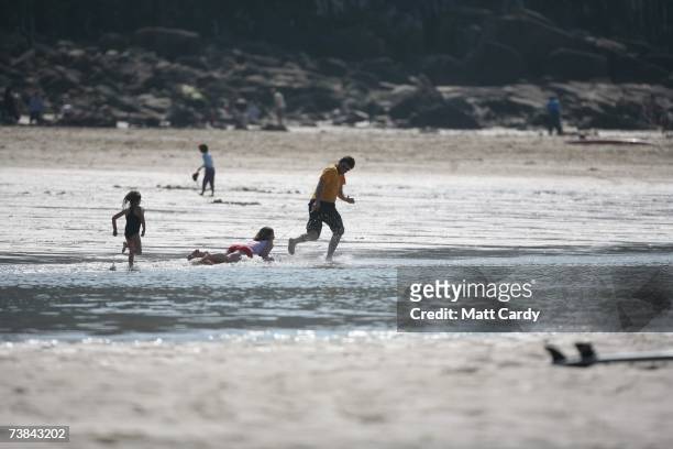 Family enjoys the holiday sunshine in Sennen on April 9, 2007 in Cornwall, England. The UK's Easter weekend was blessed with good weather with...