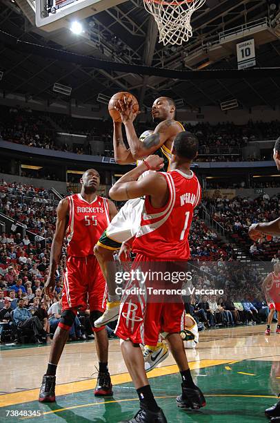 Rashard Lewis of the Seattle SuperSonics goes for the basket against Tracy McGrady of the Houston Rockets on April 9 , 2007 at the Key Arena in...