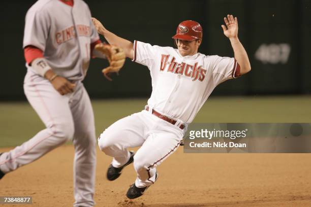 Chad Tracy of the Arizona Diamondbacks slides into third base against the Cincinnati Reds during a Opening Day game on April 9, 2007 at Chase Field...