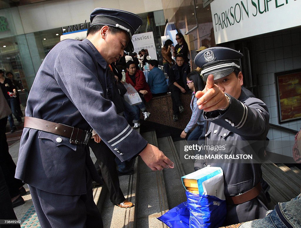 Chinese economic police inspectors with...