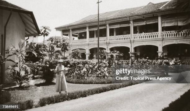 View of a courtyard at the colonial-style Raffles Hotel, Singapore, December 1925.