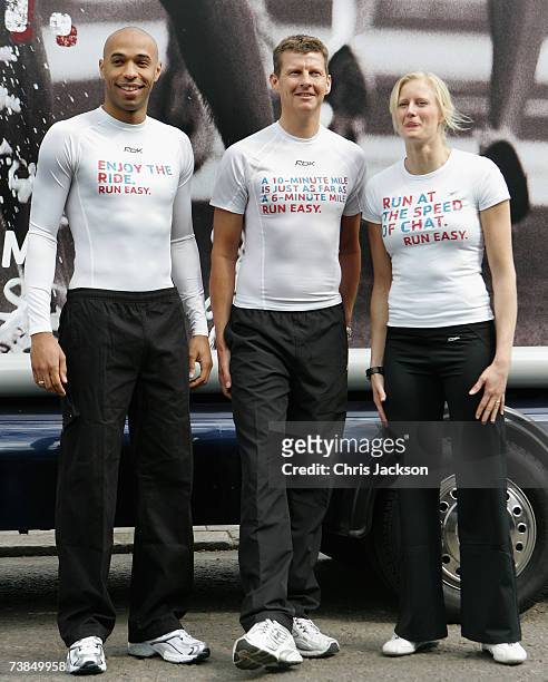 Thierry Henry of Arsenal, Steve Cram, former middle distance runner and Carolina Kluft, current Olympic, World and European heptathlon champion pose...